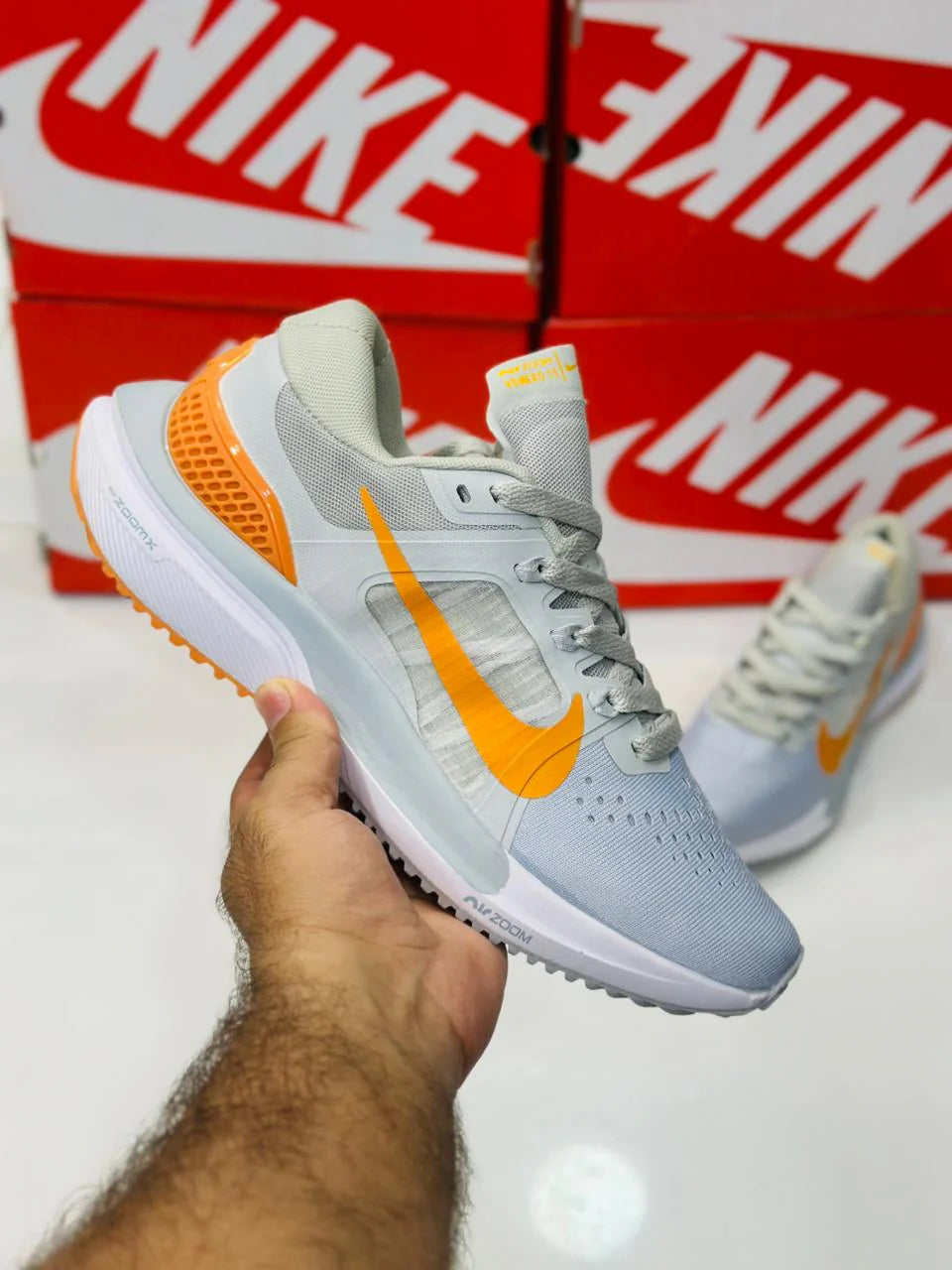 NIKE AIR ZOOM VOMERO 15 MULTI GREY AND ORANGE
