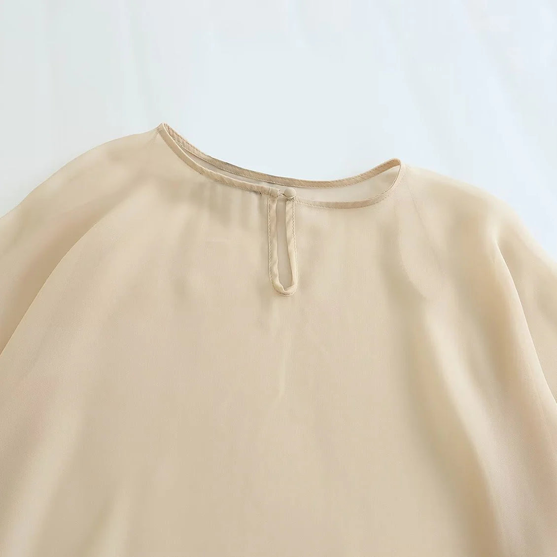 Blusa Capa Assimétrica